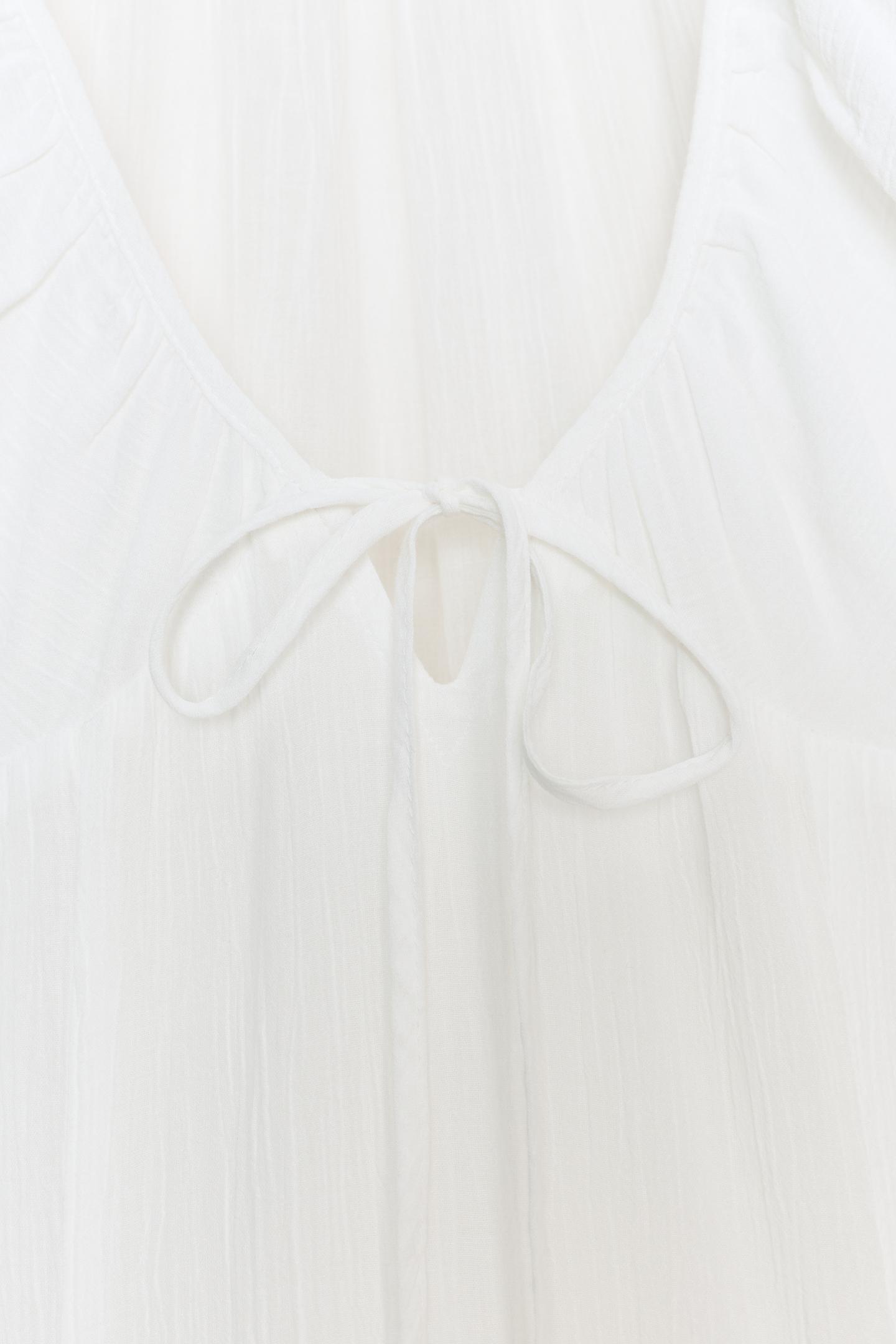 Robe mi-longue en gaze avec godets blanc