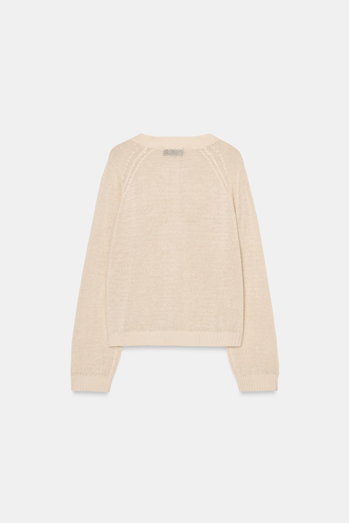 PULL EN MAILLE À BOUTONS